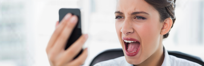 Picture of woman screaming at mobile phone