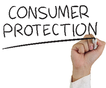 Hand writing 'consumer protection' on clear panel with marker 