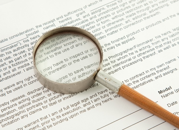 Magnifying glass on top of document